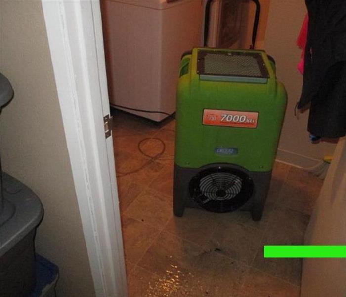 SERVPRO'S dehumidifier placed to absorb moisturer.