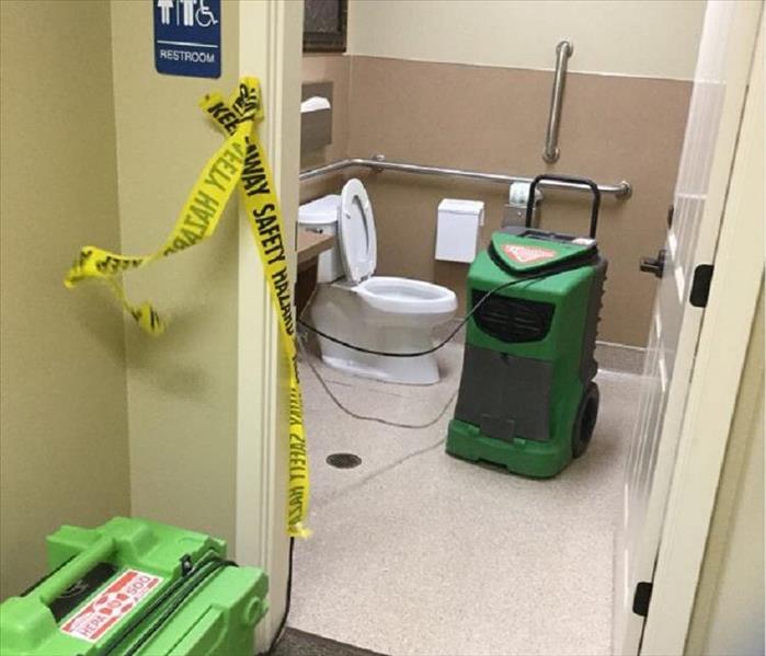 A commercial building bathroom after water damage.