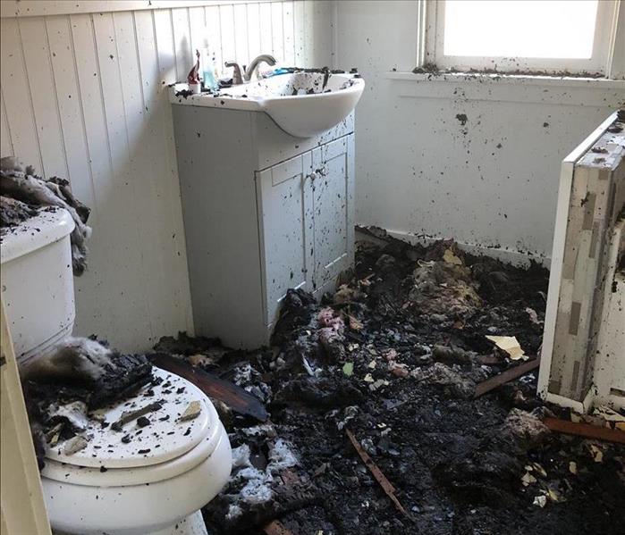 A bathroom after a house fire.